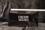 Black bag with 'FIRESAK' branding on a dark background