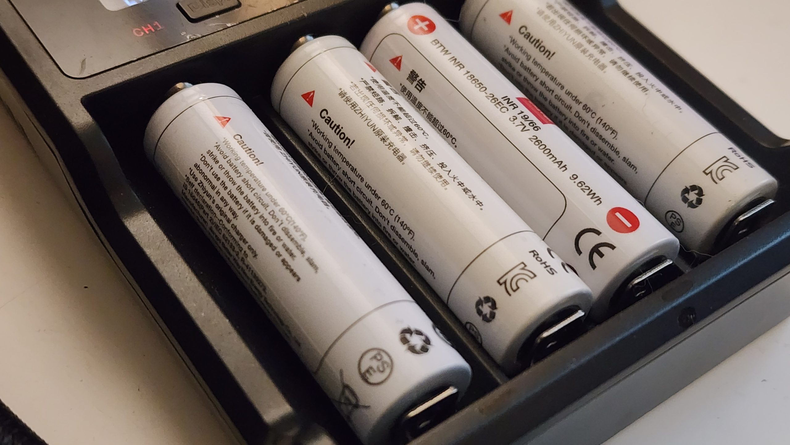 Four 18650 lithium battery cells in a charger
